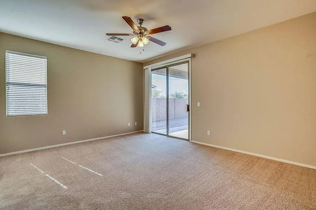 Master bedroom with ceiling fan - 3470 E Riopelle Ave