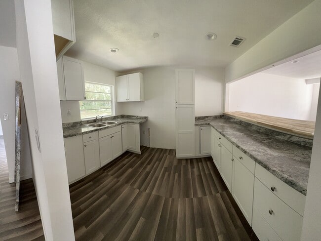 kitchen with bar stool counter top - 112 Big Apple Rd