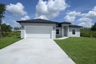 Building Photo - Brand-New & Modern! 4/2/2 Home in Desirable SW Lehigh Acres