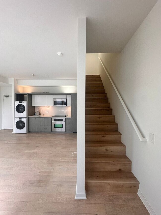 Building Photo - DOWNTOWN GEM | Modern Two-Level Loft with Private Patio & Rooftop Deck