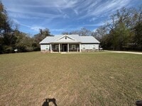 Building Photo - Available Now: Expansive 4BR Home with Rare 3-Bay Carport