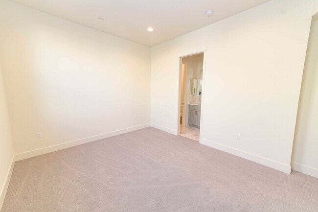 Building Photo - Experience contemporary urban living at its finest. Private Garage & Dual Suites!