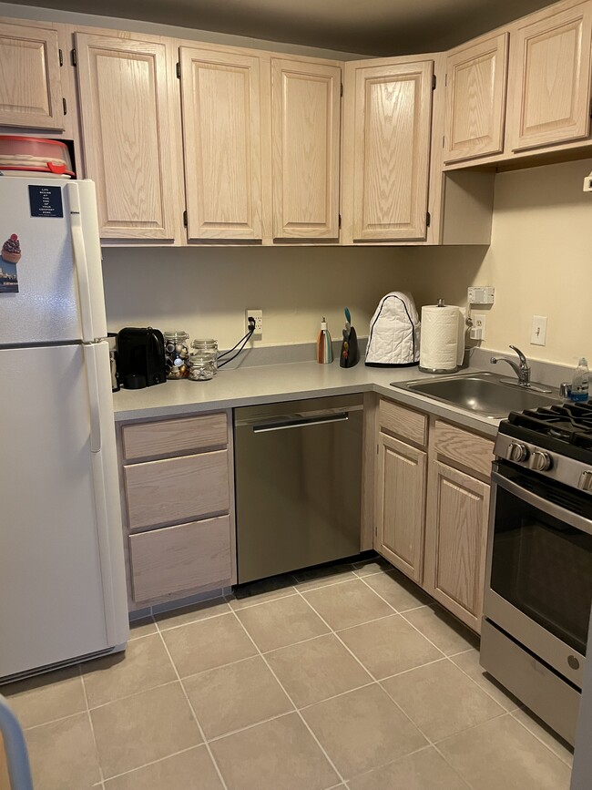 New stove; new dishwasher; new floor tile - 4555 MacArthur Blvd NW