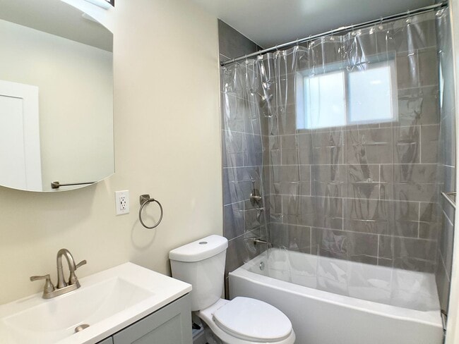 Building Photo - REMODELED 4BR/3BA. In Unit Laundry! Dishwasher! Bay Windows!