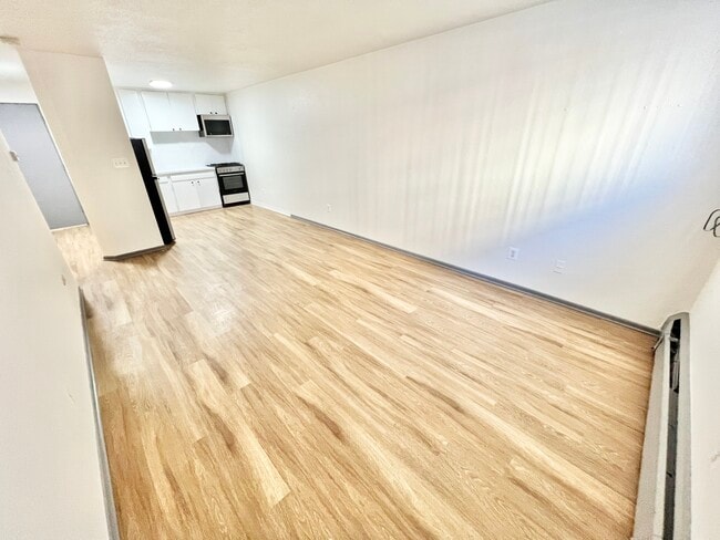 Step into this bright and airy kitchen, perfect for crafting culinary delights. - Melody Apartments