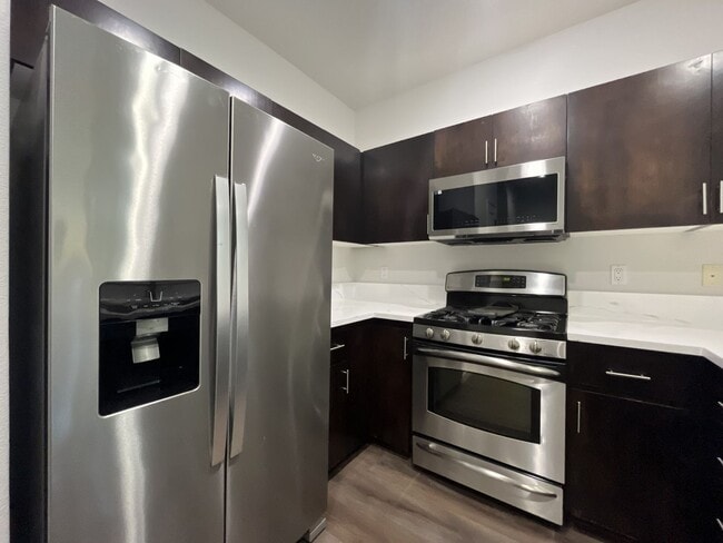 Building Photo - Beautifully Updated Bethany Townhome with Private Backyard and Modern Finishes