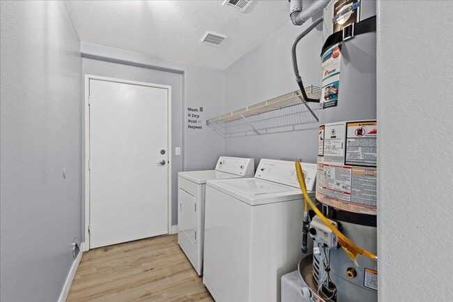 Building Photo - Sleek 2 Bedroom Condo with 2 Car Garage Ne...