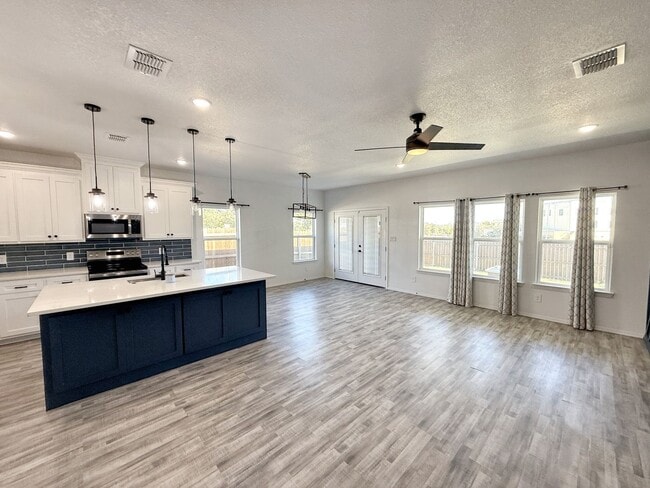 Building Photo - Modern 4-Bedroom Retreat with Patio Deck &...