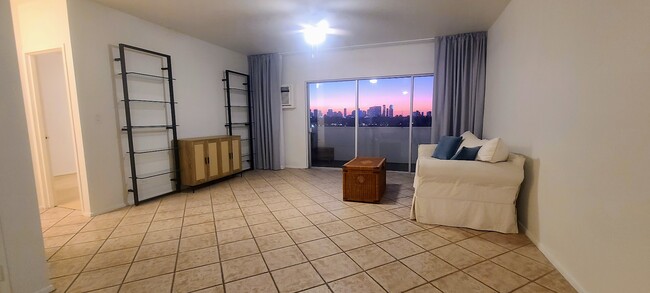 Living Room with ceiling to floor sheer and blackout curtains. - 3 Island Ave