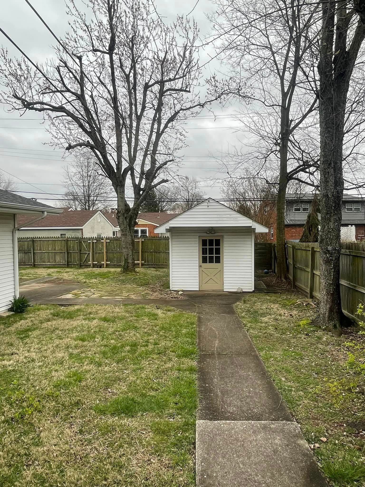 fenced in yard with storage - 1506 Tamarack Rd