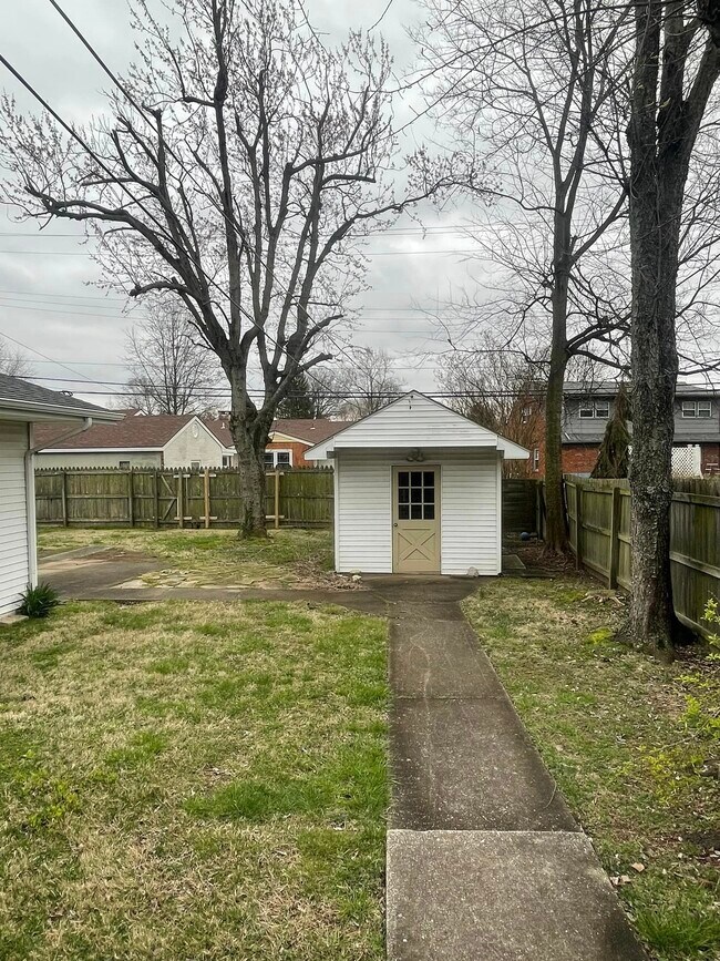 fenced in yard with storage - 1506 Tamarack Rd