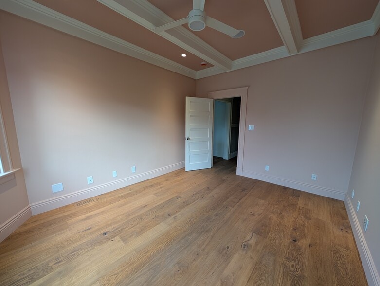 Coffered ceiling features in-ceiling speakers, a fan, and dim-to-warm cozy lighting at night. - 328 Lexington St