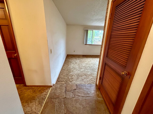 Entry Foyer/Step down Family Room now without carpet but luxury vinyl floors - 8519 49th St W