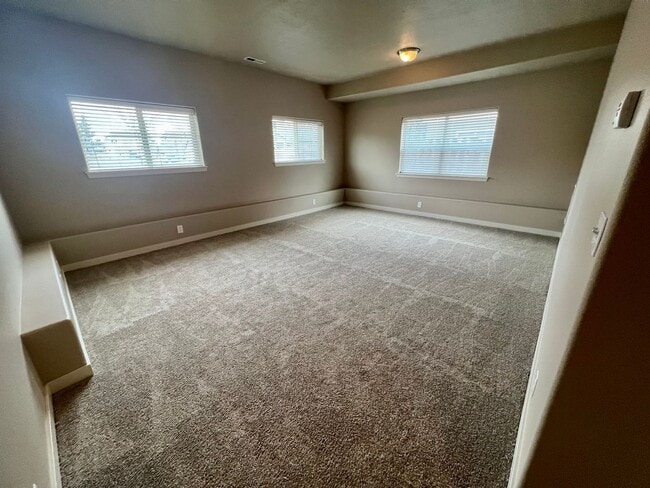 Building Photo - Spacious 4-Bedroom Home—Quick Drive to Dow...