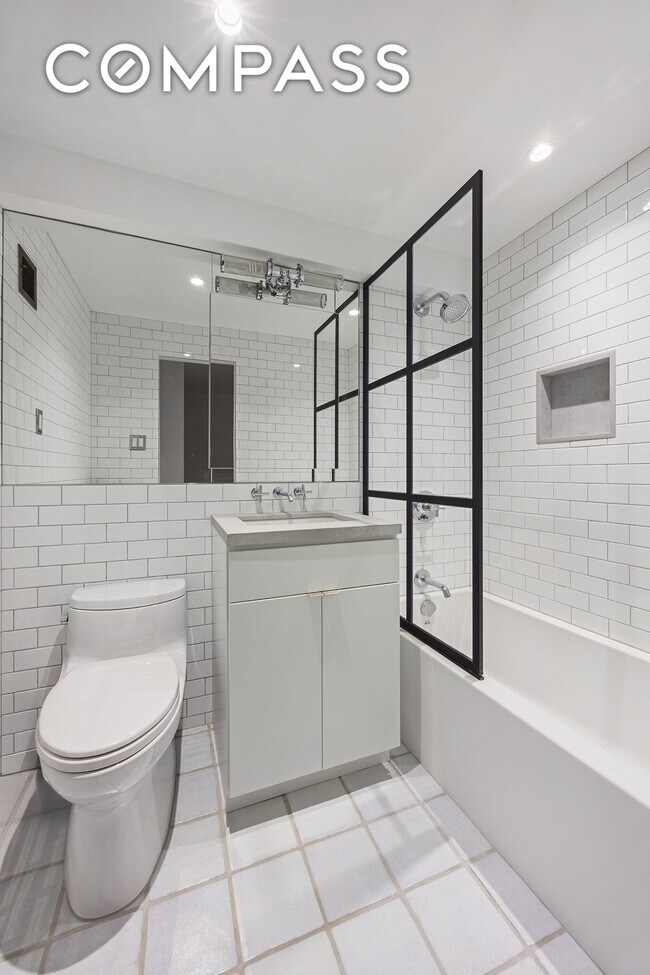 Building Photo - Loft-style one-bedroom with double-height ceilings, oversized windows, and private garden in the ...