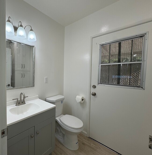 Powder room with laundry - 11052 Plainview Ave
