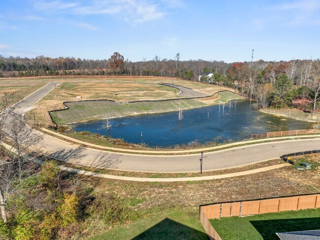 Building Photo - Stunning 4-Bedroom Home with Serene Pond Views