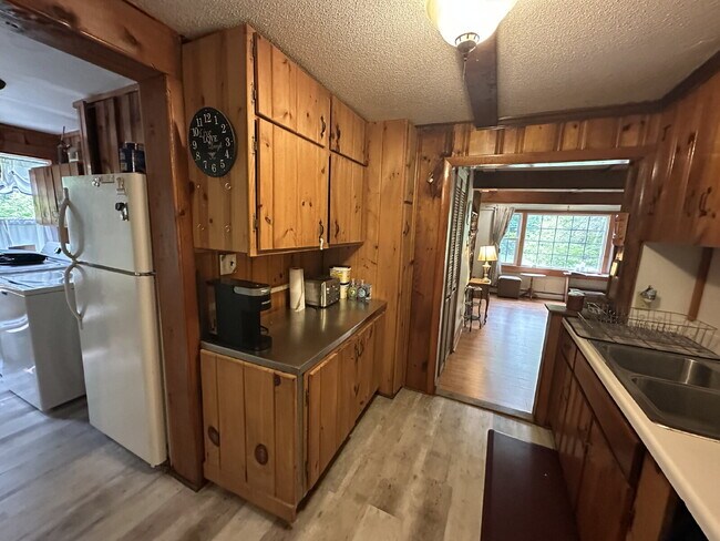 Building Photo - Charming 3BR Waterfront Retreat with Sunroom, Brick Accent & Scenic Lake Views