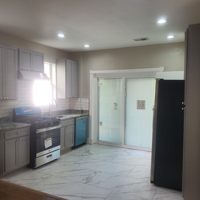 Newly renovated kitchen with French doors to Deck - 1517 Beaver Heights Ln