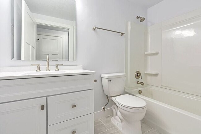 Building Photo - ROW END TOWNHOUSE W 2 CAR GARAGE + AMENITIES