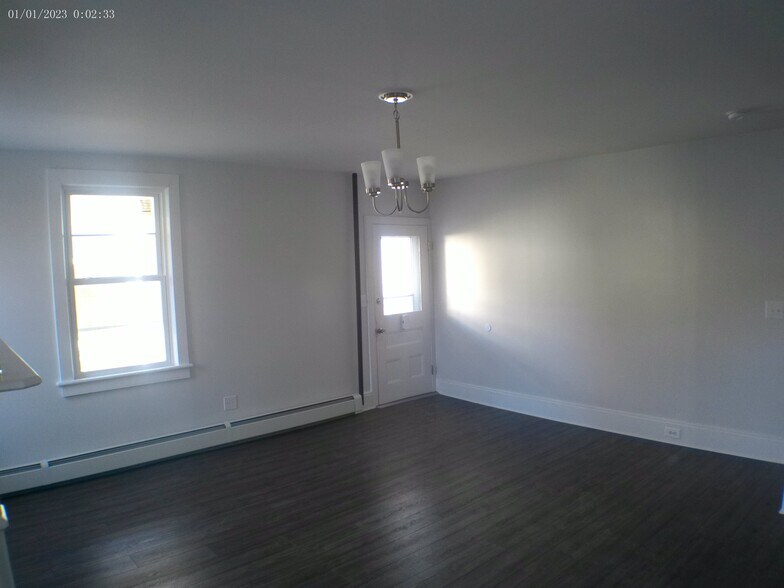 Light switches at both entrances for Living room and Kitchen. Never walk into a dark room. - 35 Main St