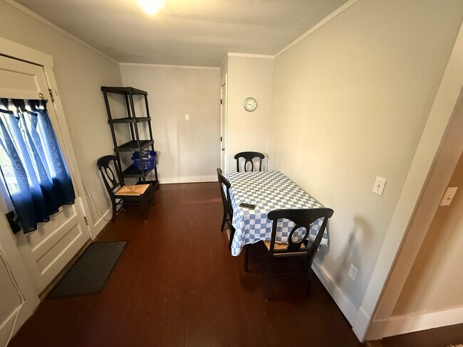 Dining area with utility closet and storage shelves - 215 N Emmett Ave
