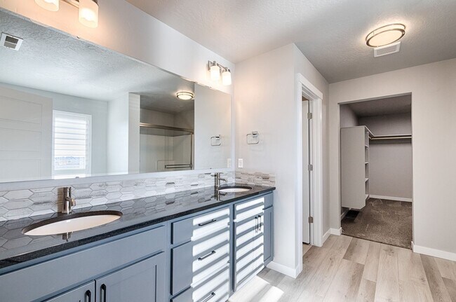 Building Photo - Custom Hunter-Douglas shutters throughout.