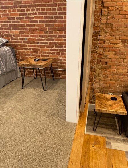 Division of bedroom and living area with barn doors - 106 W Michigan Ave