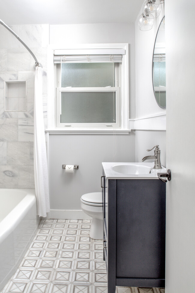 Full Bath with all new fixtures, marble floors and surround - 1408 E 48th St