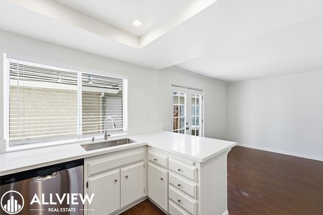 Building Photo - Fully Renovated 2 Bed Townhome with Private Patio, 2-Car Garage & Community Pool