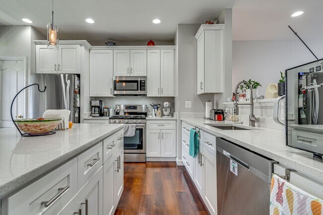 Building Photo - Belmont Bay Beauty! Three level two car ga...