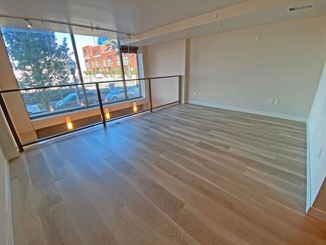 Building Photo - Live at The Axis High-Rise! Upscale, Urban...