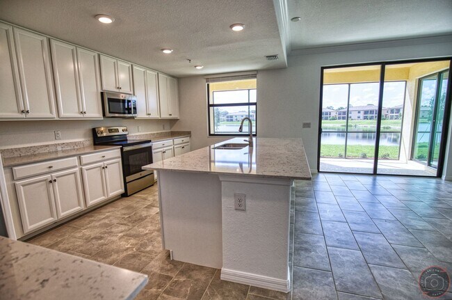 Building Photo - Annual Unfurnished Rental – New Construction Coach Home 3 Bedrooms, 2 Baths, 2 Car Garage, with R...