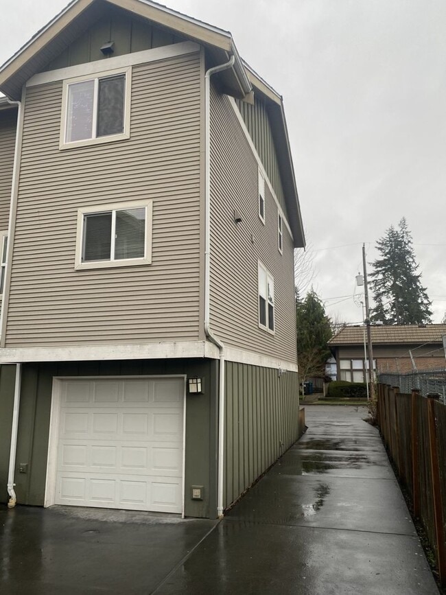 Building Photo - LIKE NEW three bedroom with fantastic updates, one car garage and private newly fenced front patio!