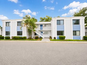 Building Photo - Updated 2-Bedroom Condo with Screened Lanai with water included.
