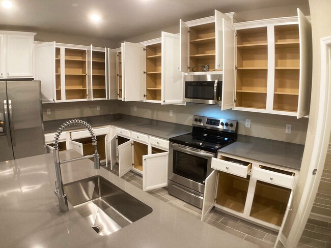 Building Photo - Your Private Escape with High-End Finishes...
