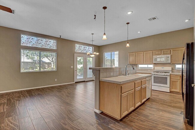 Building Photo - Gorgeous NW Single Story! 3 Car Garage! Serene Backyard.