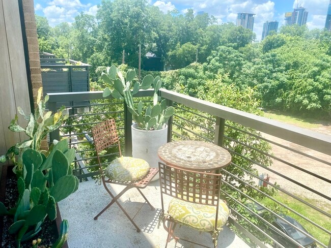 The balcony has a bistro table for morning coffees and afternoon sun. - 1501 E 4th St