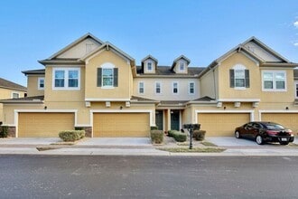 Building Photo - Gorgeous 4/2.5 Spacious Townhome with a Loft Area and a 2 Car Garage in the Desirable Gated Commu...