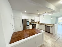 Building Photo - Lake Views. Upgraded Finishes. Gated Commu...