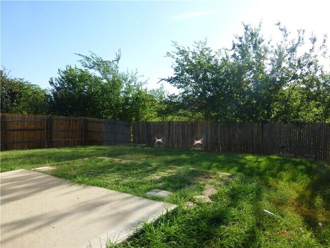 Building Photo - Generous Four Bedroom, Three Bath Home with Large Yard