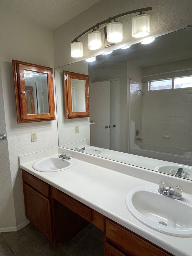 Building Photo - SPACIOUS HOME - NEW FLOORING! - 2 LIVING A...