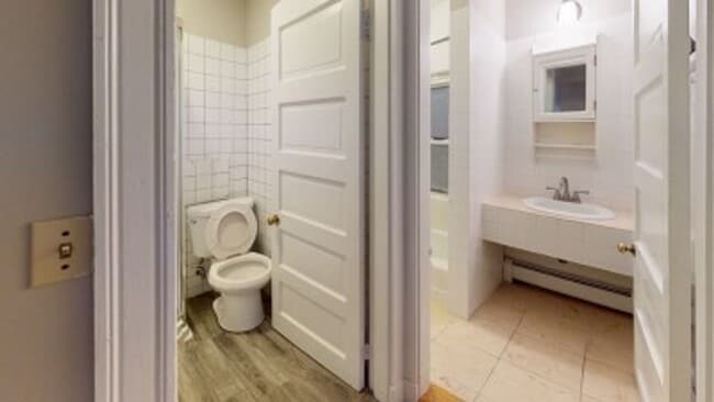 Building Photo - Renovated 6BR with In-Unit Laundry, 3 Parking Spaces & Commuter Rail Access