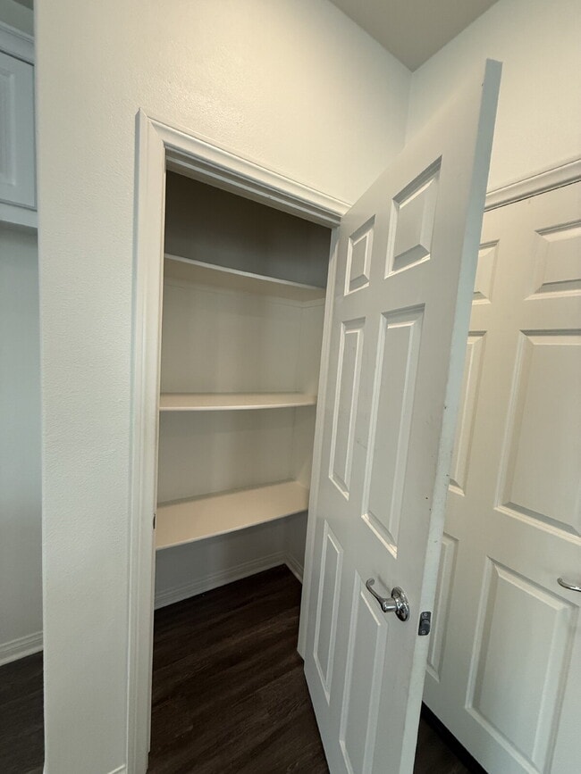 Building Photo - New flooring & paint!  Large backyard - landscaped and ready for garden!   Community pool, fitnes...