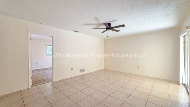 Building Photo - SPACIOUS SARASOTA HOME WITH LARGE FENCED YARD! MOVE IN READY! ALL TILE/ NEW LVP!