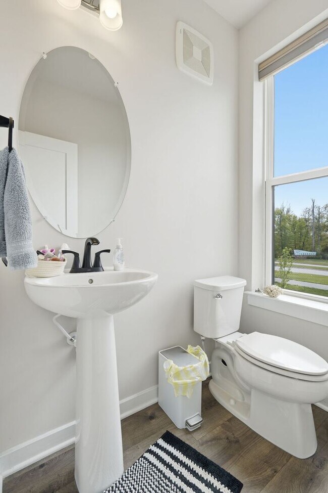 Building Photo - Perfectly positioned near the vibrant shopping and dining destination of One Loudoun, this reside...