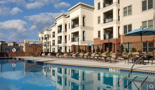 Lounge by the saltwater swimming pool with convenient outdoor pool shower - Tremont Apartments