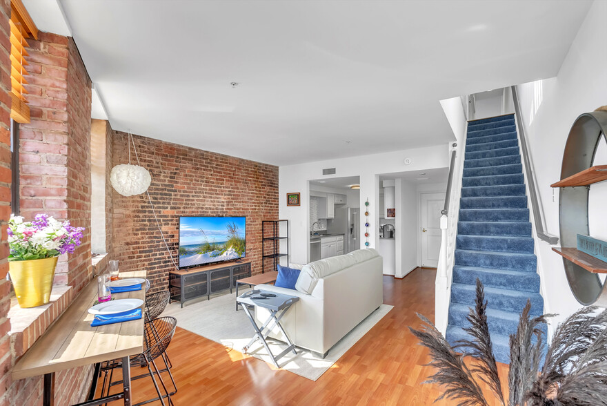 Stairs to upstairs living room, full bath and queen bedroom. - 1000 Fell St