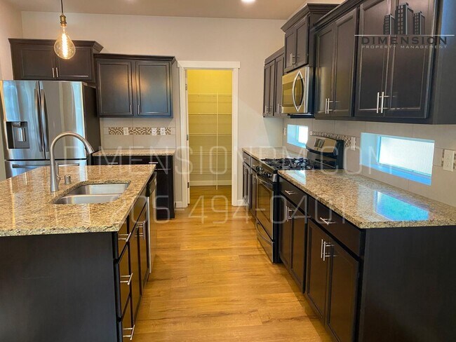 Building Photo - Spacious 4 Bed, 2.5 Bath Home with Garage ...