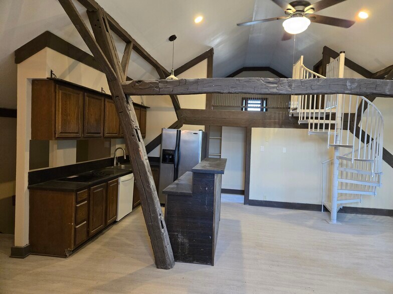 Kitchen with ample cabinet space and breakfast bar. - 60 W Winter St